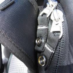 Industrial zippers at main compartment with snaps to prevent zipper crawl.